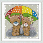 The bear couple hold up an umbrella