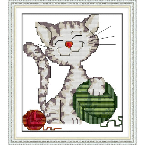 The cat playing ball of yarn