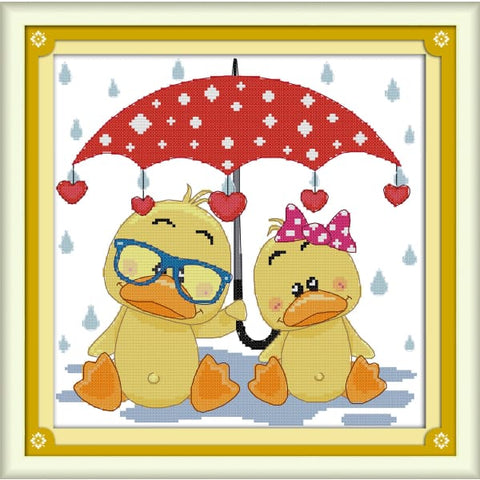 The ducks under the umbrella